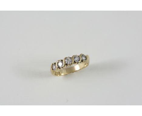 A DIAMOND HALF HOOP RING set with five circular-cut diamonds in gold. Size M.