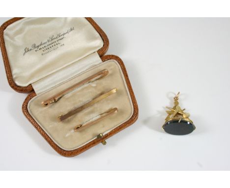 THREE 9CT. GOLD TIE PINS and a gold Masonic seal, with bloodstone matrix, 2.2cm. high.