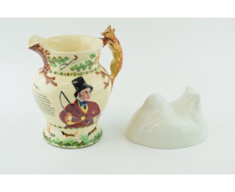 A Greens pottery jelly mould in the form of a nesting hen with a Crown Devon musical John Peel embossed jug (2). In good cond