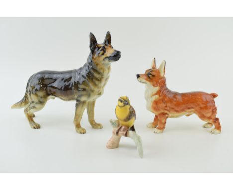 Goebel pottery to include a Corgi, an Alsatian / German Shepherd and a Goldammer (3). Two dogs are In good condition with no 