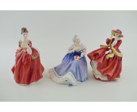 Royal Doulton figures 'Flower of Love' H.N. 3970 (a/f), 'Happy Anniversary' H.N. 3097 and 'Top of the Hill' H.N. 1834. Height