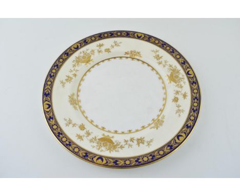 Minton patterned jewelled cabinet plate 'Dynasty' H. 3775. White ground with cobalt blue and gilt decoration. Diameter 27cm. 
