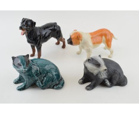 Royal Doulton dogs to include a bulldog RDA 107 and one similar, with a pair of Poole badgers, one in blue glaze (4). In good