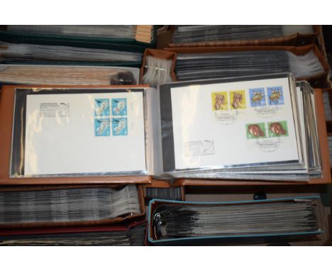 A large collection of 14 albums of First Day Covers from varying ages and themes (Qty).