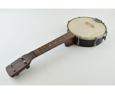 A vintage Banjolele / Ukulele. Wooden neck and wooden body. Length 56cm.