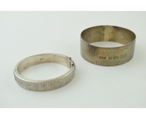 A silver bark effect bangle with a similar bracelet, 69.5g, both hallmarked (2). Catch slightly wonky but working.