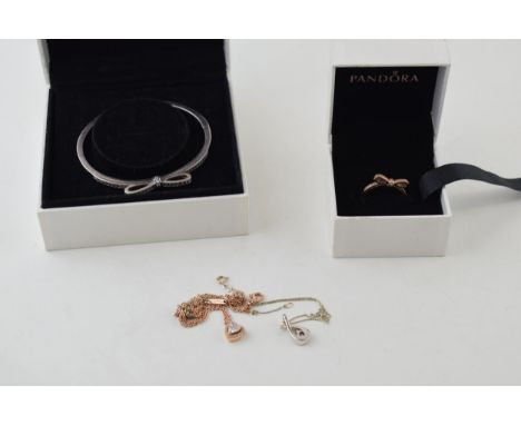 A collection of Pandora jewellery to include a gold plated ring, a silver bangle and others.