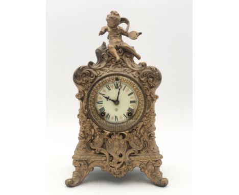 A late 19th century Rococo style brass cased mantle clock by the Ansonia Clock Company. H.32cm. 