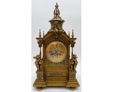 A 19th century neoclassical style French ormolu and champleve enamel mantel clock with cherub decoration, the eight day movem