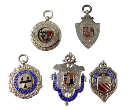 Four Worcestershire silver and enamel football badges, including Worcester and District Charity FA Droitwich United FC 1906, 