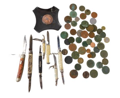 Seven folding pocket knives, horn or mother of pearl bound, together with English and European coinage, and a copper ash tray