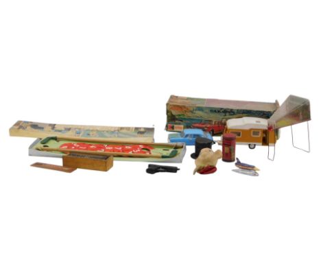 A Clifford Toys Austin 1800 and caravan, boxed, together with a Chad Valley miniature golf game, boxed, a novelty George V Po
