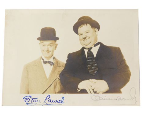 A Laurel and Hardy postcard, with facsimile signatures. 