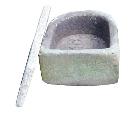 A carved sandstone D shaped trough or planter, 45cm x 39cm, 23cm high, together with a concrete slab, 29cm x 60cm.