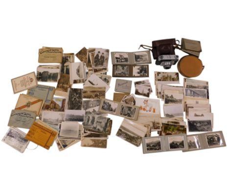 Ilford Sportsman camera, cased, with snapshots of towns and regions, and assorted topographical postcards.
