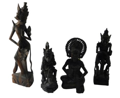 A Group of Thai and Balinese hardwood carvings, to include Yaksha, 35cm high, Dewi Sri, 33cm high, etc.