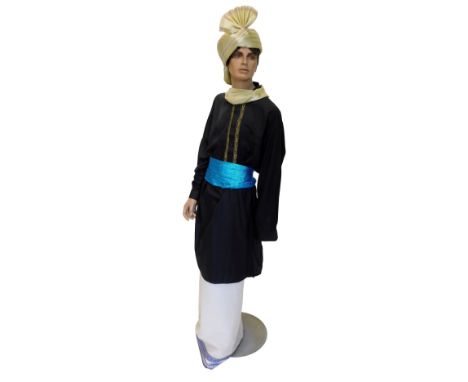 A painted plaster male mannequin, wearing Indian dress, on a circular base, 190cm high overall.