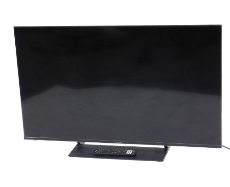 A Panasonic 50" LCD TV, with remote, model number TX-50JX850B.