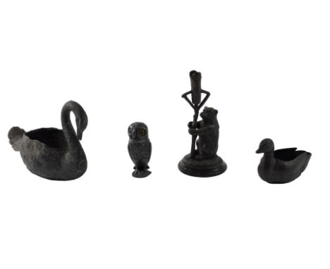A 19thC novelty pewter owl shaped pepper pot, with glass eyes, a small epergne base cast with a bear, and two pewter swans. (