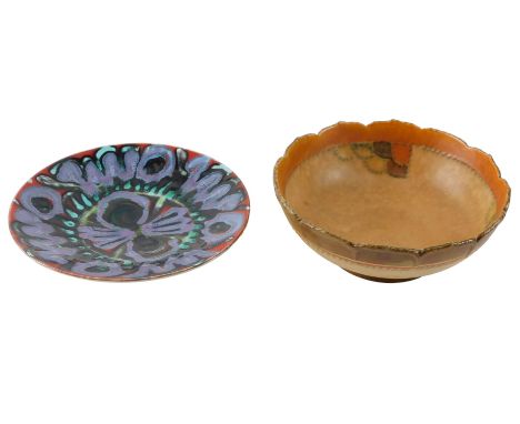A Crown Ducal tube lined bowl, in the manner of Charlotte Rhead, 26cm diameter, and a Poole Delphis small charger, 25cm wide.