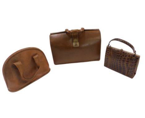 A brown leather briefcase, a brown leather bag, and a reptile skin bag. (3)