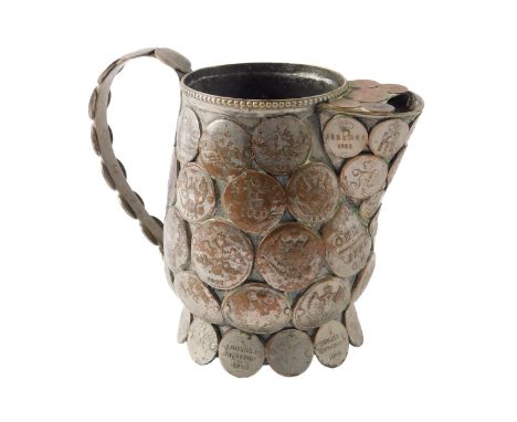 A 19thC silver plated jug, mounted with various Russian coins, 12cm high.