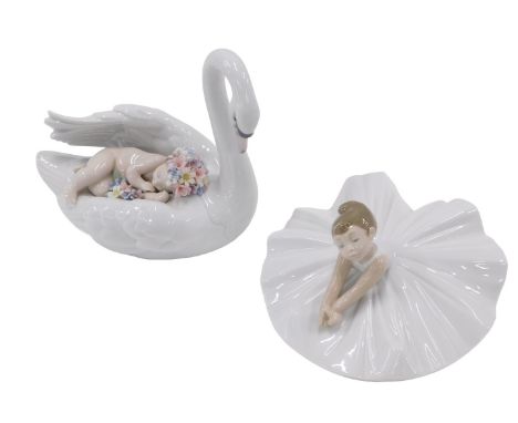 A Lladro porcelain figure of a swan, titled Drifting through Dreamland, and a Nao figure of a seated ballet dancer. (2)