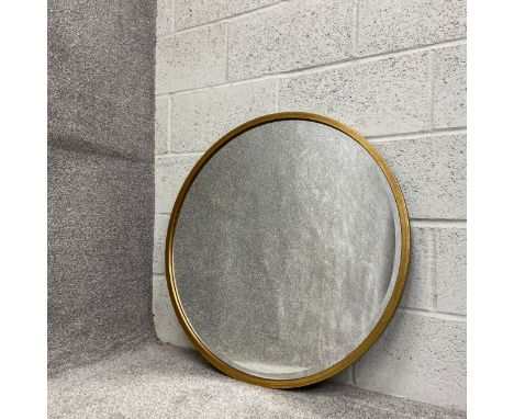 A contemporary circular wall mirror with a bevelled plate in a gilt surround. H.80 W.80cm 