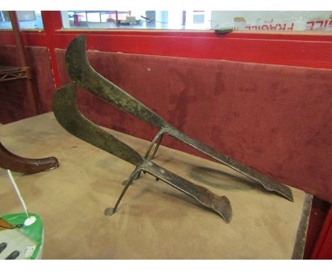 A pair of vintage blacksmith made coconut husk blades, 37cm x 56cm long 