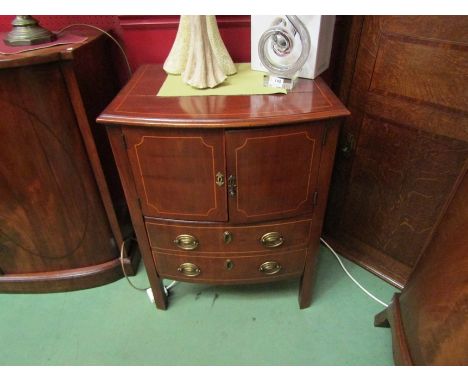 A George III flame mahogany bow front nightstand with satinwood line inlay, the two door cupboard over a single drawer. 76cm 