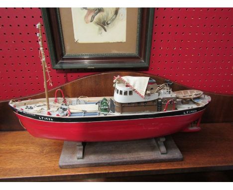 A handmade 'John McIntosh' model of a boat on stand 