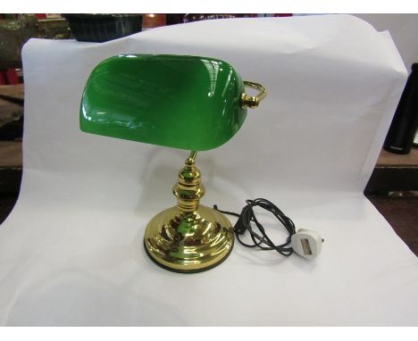 A brass based bankers lamp with green glass shade 