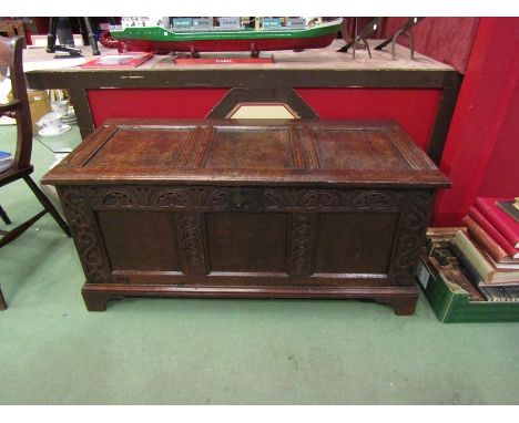 A 17th Century and later oak three panel coffer the split hinged rising top over a carved front on bracket feet.  55cm x 120c