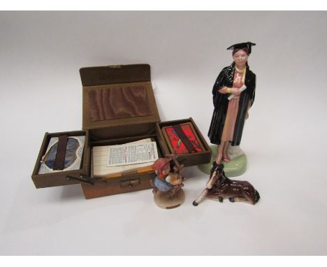 A Royal Doulton 'The Graduate' figure, Goebel figure 'Apple tree girl' pony and games box (4) 