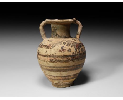 7th-6th century BC. A terracotta amphora with body divided into four horizontal registers separated by thick black and red li