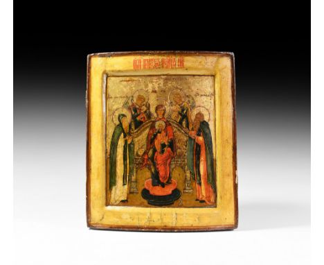 17th century AD. A curved wooden icon with raised border and mounting slots to the reverse; painted scene with facing nimbate