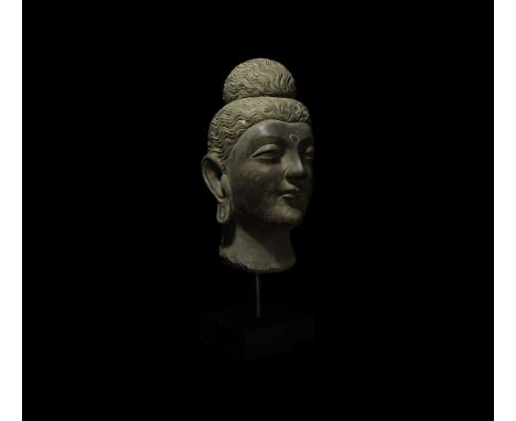 2nd-3rd century AD. Of imposing size and presence while retaining Buddha's serenity, this carved larger than life-size schist