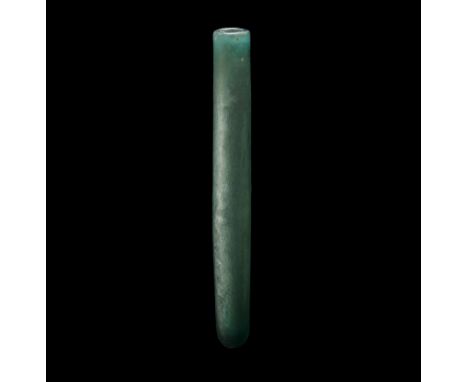 6th-8th century AD. A slender tubular glass manuscript holder with bulbous base to one end, some iridescence to the surface. 