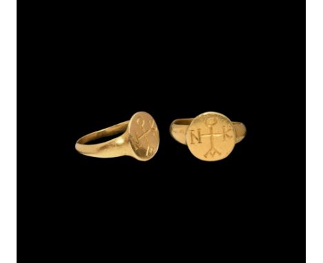 6th-7th century AD. A gold finger ring with discoid bezel, incuse monogram comprising a cross with letters N, K, A, O. Cf. Wa