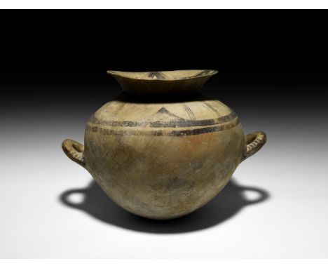 6th-5th century BC. A large ceramic greyware vase with rounded body, flared mouth, two lateral loop handles; geometric black-