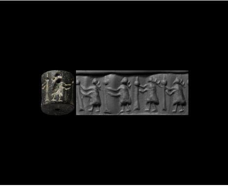 4th-3rd millennium BC. A jasper cylinder seal with frieze of women with staffs; accompanied by a museum-quality impression an