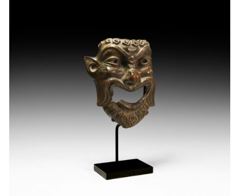 3rd-1st century BC. A good-size ceramic mask with exaggerated smile, beard, fleshy nose, pronounced cheeks and wart, wrinkled