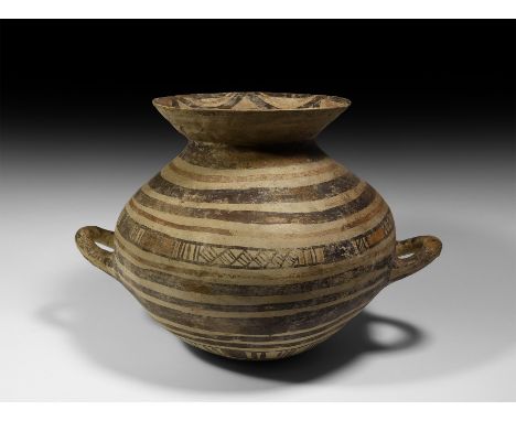 6th-5th century BC. A large ceramic greyware vase with rounded body, flared mouth, two lateral loop handles; circumferential 