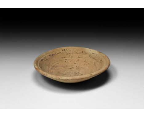 4th-8th century AD. A ceramic flat-based bowl, inscribed in spiral from the bottom inner wall to the rim with a magic Aramaic