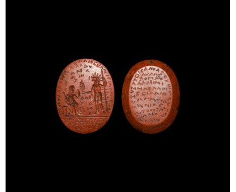 3rd-4th century AD. A jasper gemstone for a pendant with text and decoration; obverse with intaglio scene depicting a standin