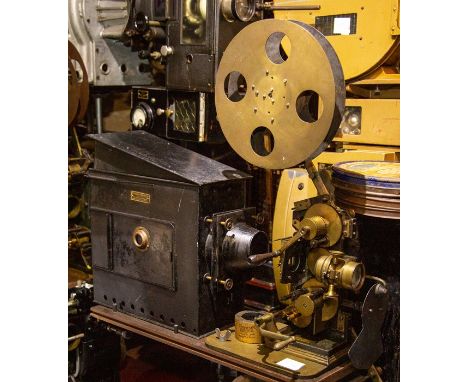 A Prestwich 35mm movie projector with beater movement and a W. Butcher & Sons No. 1 Maltese cross Empire Lantern. c.1910Pleas