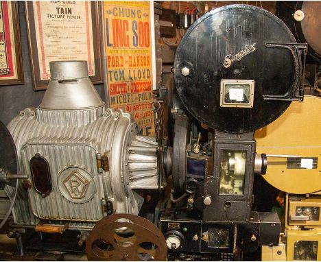 A Simplex 35mm movie projector on Universal base and Ross low-intensity lamp with Kalee 21 mechanism with top spool box and a