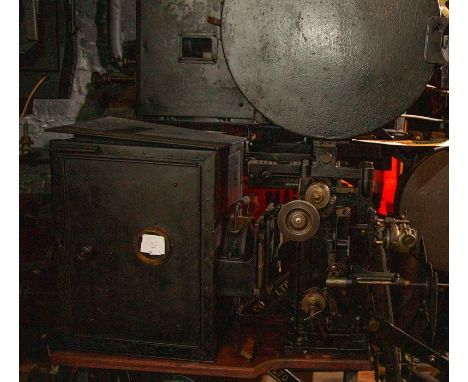 A 35mm movie projector (unidentified). Front shutter, top and bottom arms, 32 teeth sprocket, Kalee influenced, low intensity