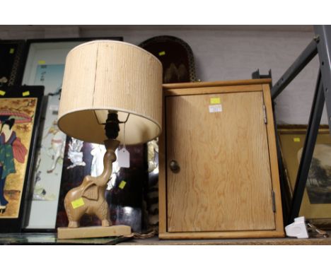 Decorative table lamp with elephant base and shade, and small corner cupboard, height 44 cm, width 33 cm 