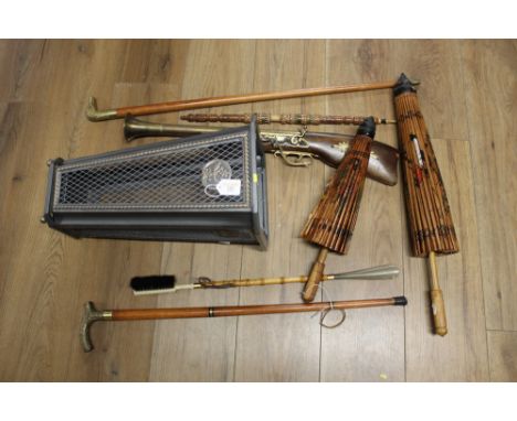 Umbrella and stick stand, sticks and umbrellas, ornamental gun 